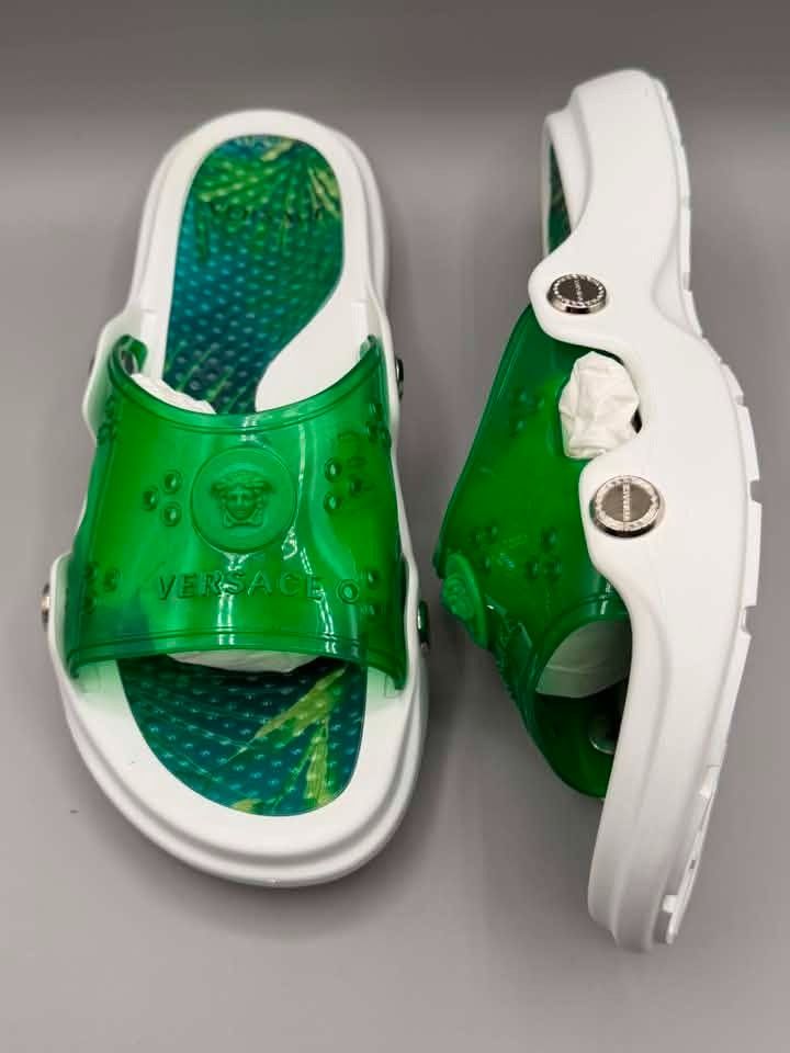 Versace Medusa Slides Green White (Category: Slippers and slides) located in Caloocan City. Submitted by epicfalcon.e5a84c (Listing ID 1459340812, Image 1). Description: - Authentic Versace slides - Color: Green and White - Iconic Medusa head logo on strap - Green leaf pattern on insoles - Easy slip-on style - Ideal for casual wear.
