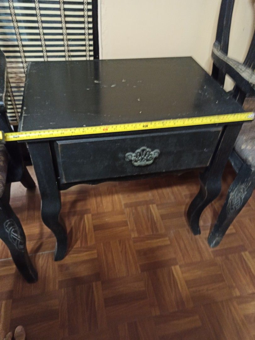 Solid Wood Vintage Black Side Table with 2 Matching Chairs (Category: Tables & Sets) located in Caloocan City. Submitted by rtarellano (Listing ID 1459293970, Image 3). Description: - Set of SOLID 2 vintage black chairs, table with drawer - Chairs feature patterned fabric seats - Ornate wooden backs on chairs - Matching side table included - Side table has a single drawer with decorative metal pull - Minor scuffs on table surface and legs (consis