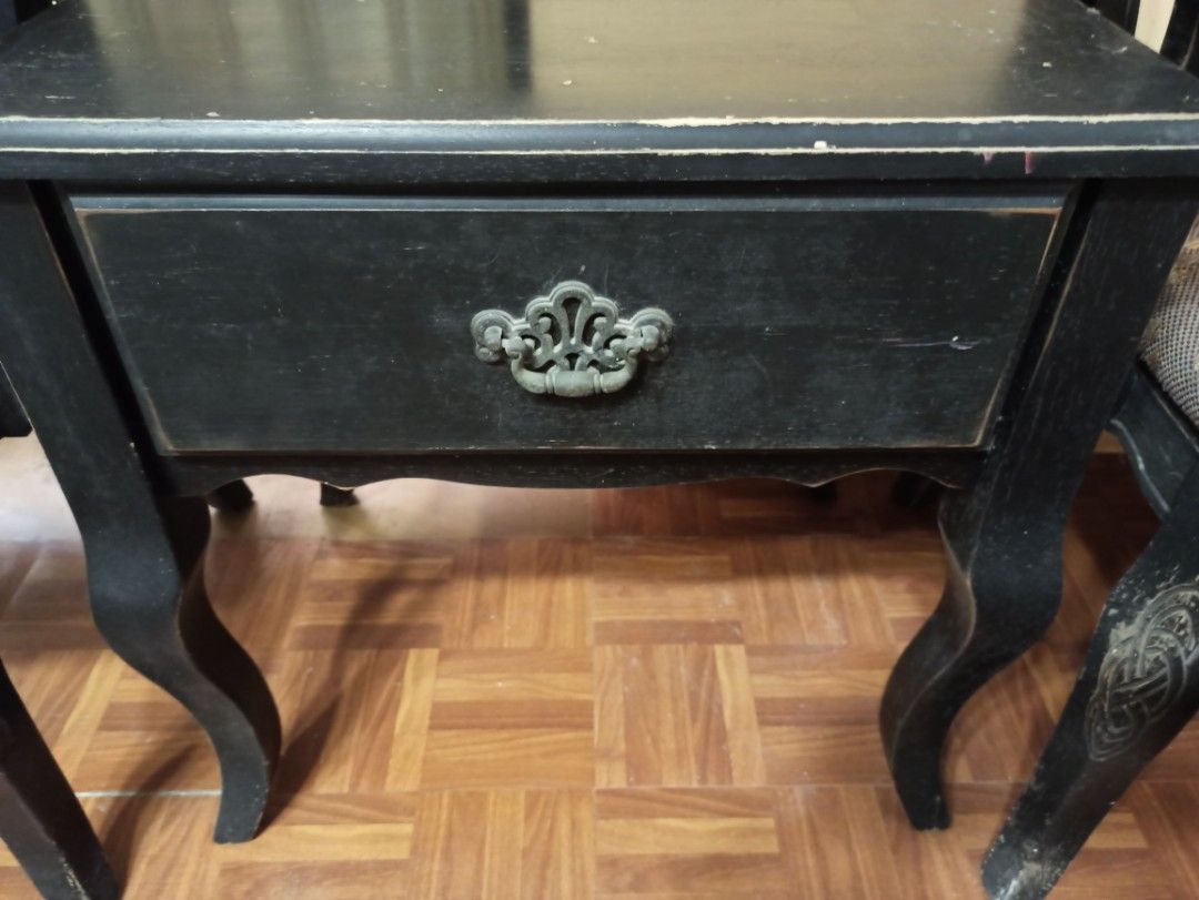 Solid Wood Vintage Black Side Table with 2 Matching Chairs (Category: Tables & Sets) located in Caloocan City. Submitted by rtarellano (Listing ID 1459293970, Image 2). Description: - Set of SOLID 2 vintage black chairs, table with drawer - Chairs feature patterned fabric seats - Ornate wooden backs on chairs - Matching side table included - Side table has a single drawer with decorative metal pull - Minor scuffs on table surface and legs (consis