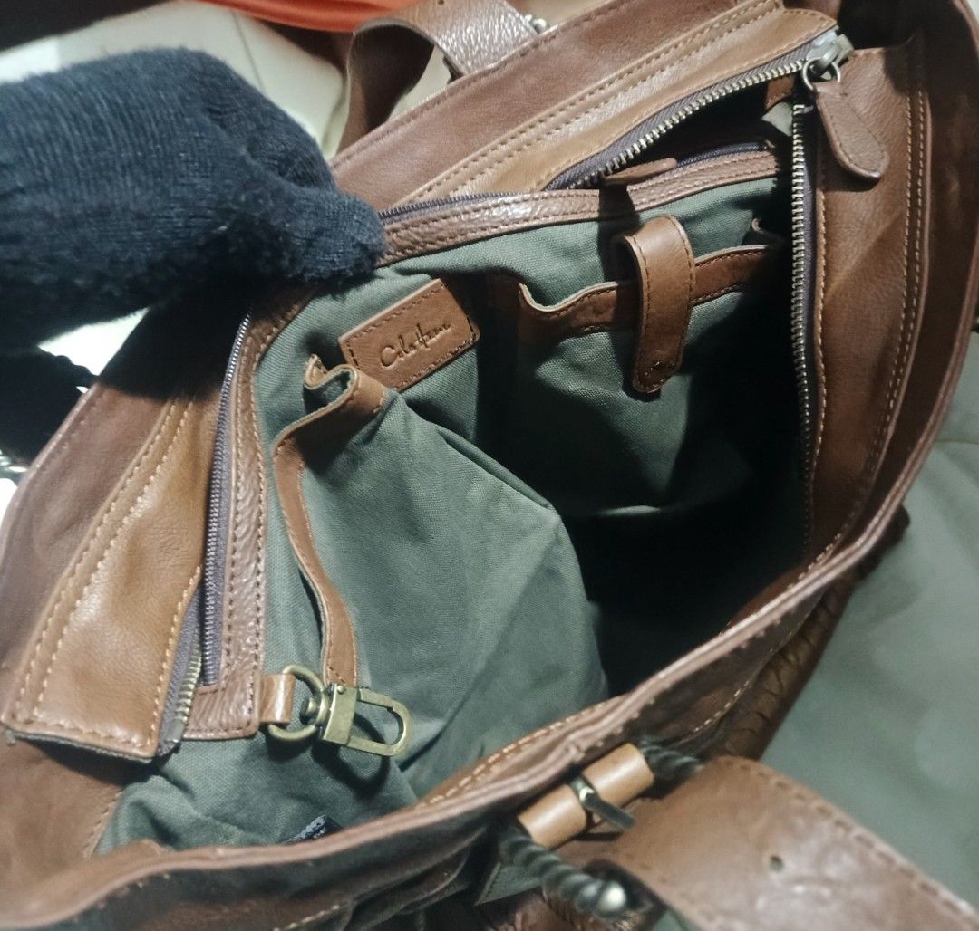 Vintage Cole Haan Metallic Brown (Category: Luxury Bags & Wallets) located in Urdaneta. Submitted by bernalyn25 (Listing ID 1459428747, Image 3). Description: -Metallic brown leather bag - Braided handles - Zip closure - Spacious interior - Unique textured leather look - Perfect for everyday.
