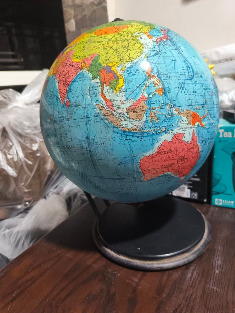 Vintage Educational Globe with Stand (Category: Vintage Collectibles) located in San Leonardo. Submitted by burgossanleonardo.12345 (Listing ID 1459436047, Image 1). Description: - Educational globe showing countries and continents - Mounted on a sturdy black stand - Ideal for learning or decorative purposes - Features Asia, Australia, Africa, and parts of Europe - Stand shows some signs of wear - Approximately 14 inches in height.