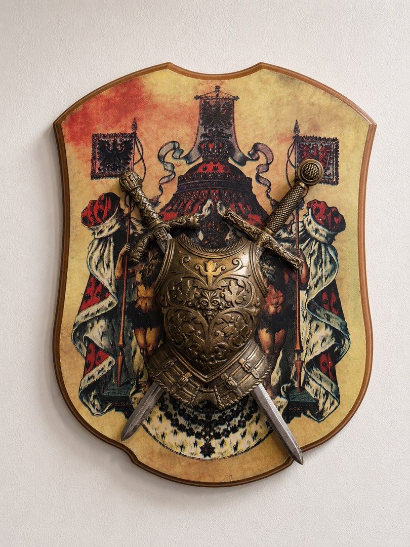 Vintage Medieval Style Heraldic Shield Wall Plaque (Category: Wall Decor) located in Calamba. Submitted by chebvintagedepot (Listing ID 1459335525, Image 1). Description: [B04-03] This vintage medieval-style wall plaque features a decorative miniature metal breastplate and two crossed display swords mounted on a shield-shaped wooden backing. The shield features a printed royal heraldic design with figures, imperial crowns, and heraldic flags. The