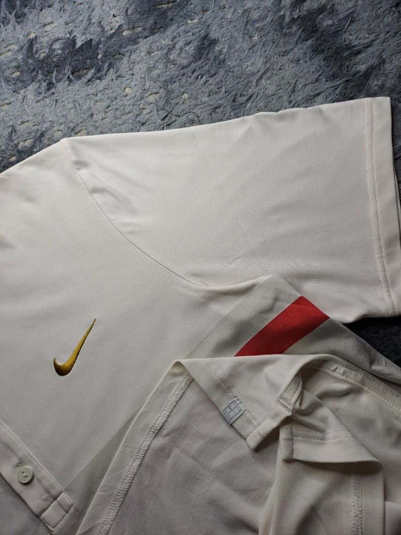 Vintage Nike Roger Federer "RF" 2012 (Category: Activewear) located in Manila. Submitted by yaseen__73 (Listing ID 1459346110, Image 2). Description: Vintage Nike Roger Federer "RF" Smash Stripe Tennis Polo. Originally released around 2012, it was famously designed for Roger Federer to wear during the Australian Open and other ATP Master Events Color : Smash Stripe Off - White/Grey/Red L on Tag Dimensions: See Photo Color Rate: 9.7/10 With Minor 
