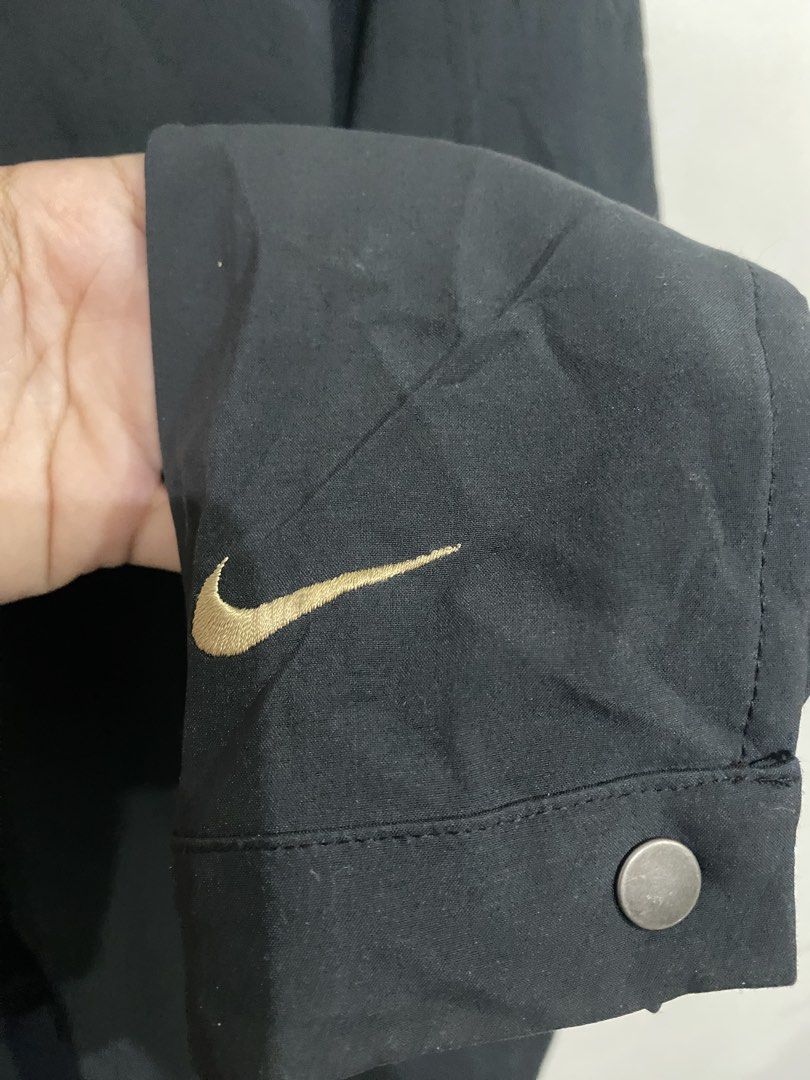 Vintage Nike Sphere Pro Black Jacket XL (Category: Coats, Jackets and Outerwear) located in Baliuag. Submitted by macyjoythrift (Listing ID 1459475133, Image 3). Description: - Black Nike Sphere Pro Jacket - Size XL - Made in Sri Lanka - Features a gold Nike swoosh on the sleeve - Zipper closure - Ideal for casual wear or sports activities.