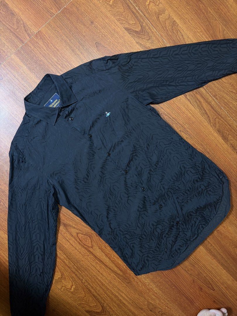 VIVIENNE WESTWOOD BUTTON UP ORB LONGSLEEVE (Category: Formal Shirts) located in Cavite. Submitted by frankiemnla (Listing ID 1459325572, Image 2). Description: L- 30 W- 22 Size- Med to Large * black * cotton * poplin texture * signature Orb logo embroidery * button-down collar * front button fastening * long sleeves * buttoned cuffs * curved hem .