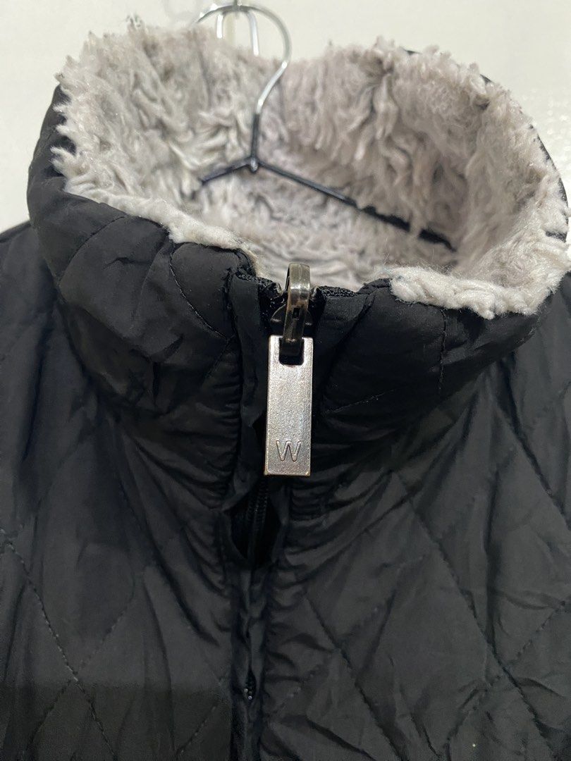 Weatherproof Reversible Quilted Fleece Vest (Category: Vests) located in Baliuag. Submitted by macyjoythrift (Listing ID 1459473237, Image 3). Description: - Reversible vest from Weatherproof - Side 1: Quilted black with faux fur lining - Side 2: Fluffy grey fleece - Full zip closure - Perfect for layering and cooler weather.