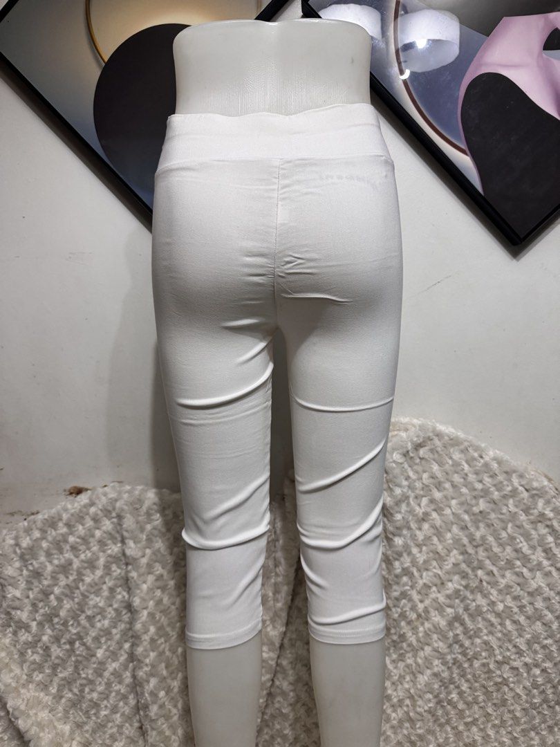 White Capris Cropped Jeggings Pants (Category: Other Bottoms) located in Marikina City. Submitted by lorradel (Listing ID 1459438495, Image 3). Description: - waist 24in -length 25 in - White cropped leggings - Stretchy material for comfort - High-waisted with V-cut front - Versatile: great for casual wear or workouts - Easy to pair with any top - MAY HAVE some washable stains (hindi maiiwasan) needs washing; had been stored - mannequin size 34-2