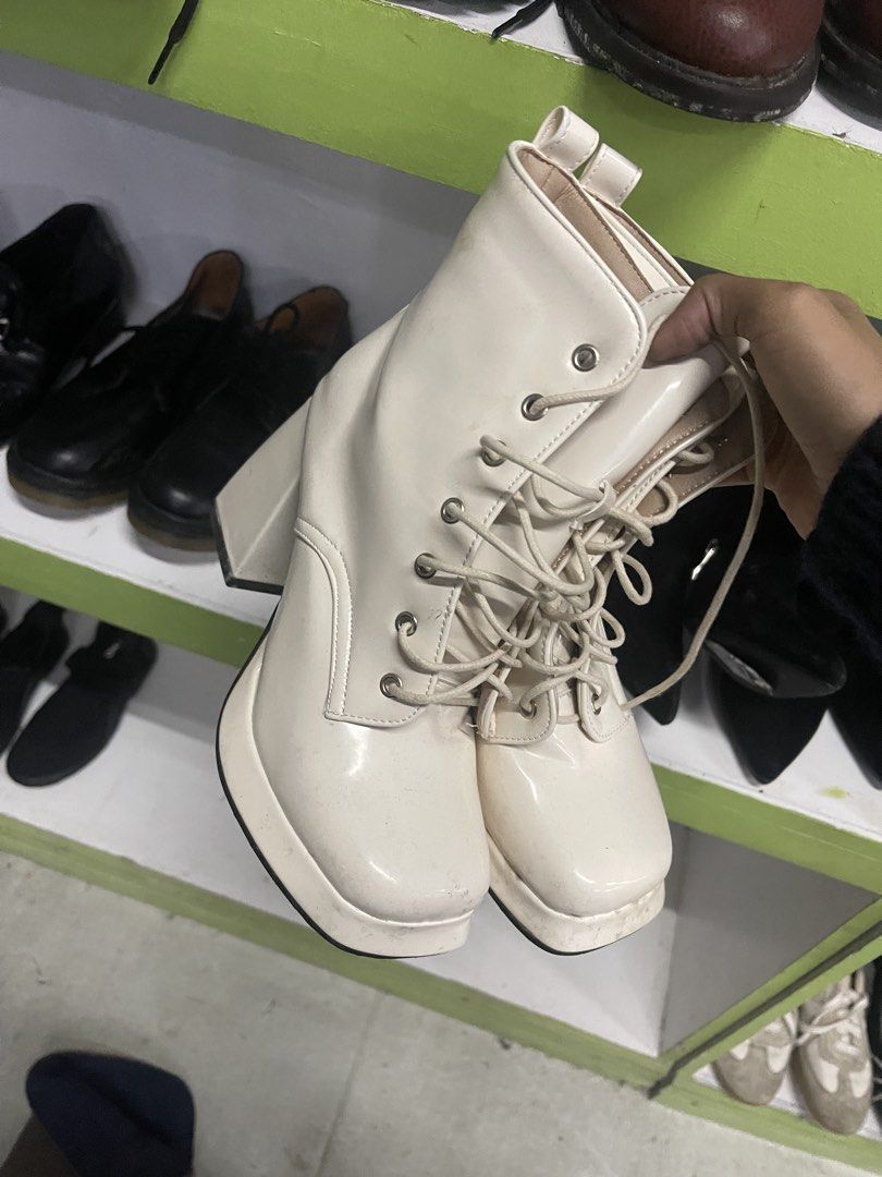 White Chunky Platform Lace-Up Heeled Boots (Category: Boots) located in Caloocan City. Submitted by potatothriftlip (Listing ID 1459385487, Image 1). Description: - White platform boots - Chunky heel - Lace-up front for a secure fit - Edgy and cool vibe - Easy to style with jeans or skirts - A must-have addition to your shoe collection.