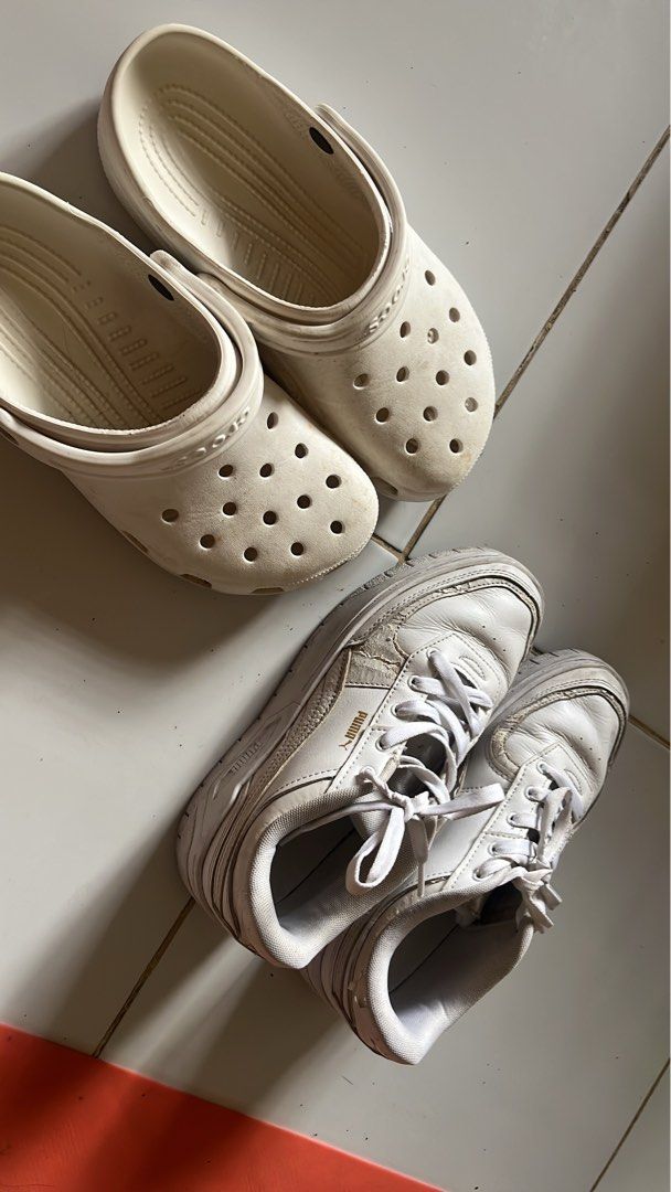 White Crocs and Puma Sneakers Bundle (Category: Sneakers) located in Manila. Submitted by jana0011 (Listing ID 1459417117, Image 1). Description: - Bundle includes: 1 pair of classic white Crocs clogs & 1 pair of white Puma sneakers. - Ideal for casual wear and everyday use. - Offers both comfort and style for your daily activities..