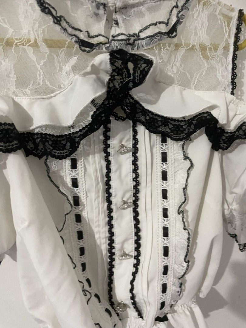 white lace jirai kei Blouse (Category: Blouses) located in Marikina City. Submitted by wontyoukissme (Listing ID 1459461358, Image 2). Description: white & black blouse - from 🍊 app - fits L - XL - no brooch included more info: MOP: gcash MOD: j&t or lalamove .