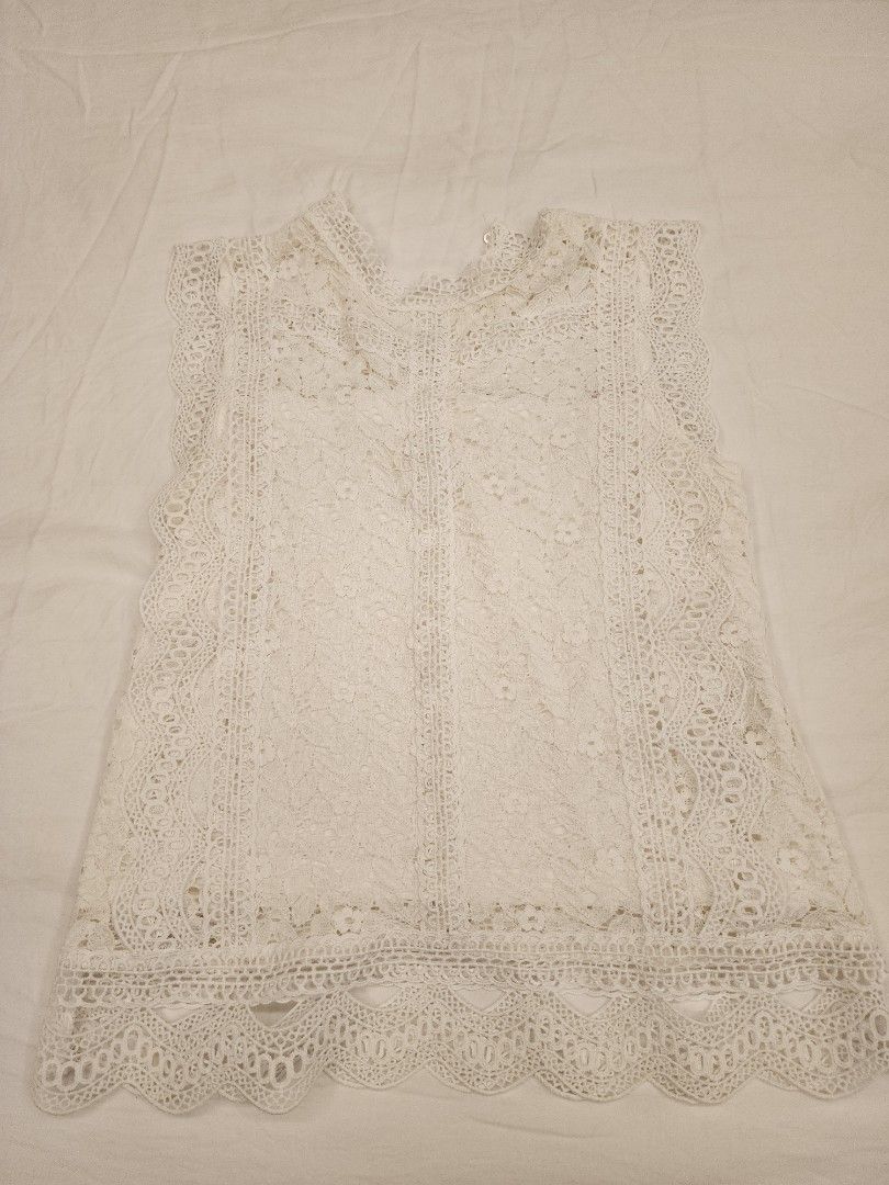White Lace Sleeveless Mock Neck Top (Category: Sleeveless) located in Manila. Submitted by wardrobemanila (Listing ID 1459360023, Image 1). Description: used twice selling low just to dispose. Considering the price sulit na to ksi mura naman. na stock lang sa kabinet ng matagal ksi hindi nasusuot no issues super nice nito bought in japan, lace pa, mahal bili ko dto pero selling low pra lang madispose - White sleeveless lace top - Features a chic 