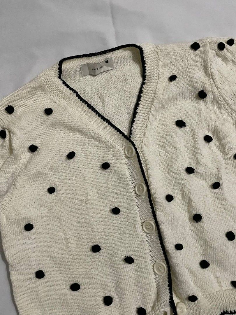 White Polka Dot Puff Sleeve Button Down Knit/Crochet Top (Category: Blouses) located in Binan City. Submitted by declutterbyjwy (Listing ID 1459394719, Image 2). Description: - can fit xs-l - quality fabric - good as new, never used - black polka dot (crochet) - perfect for layering or wearing solo minimal flaw: one missing polka dot crochet.