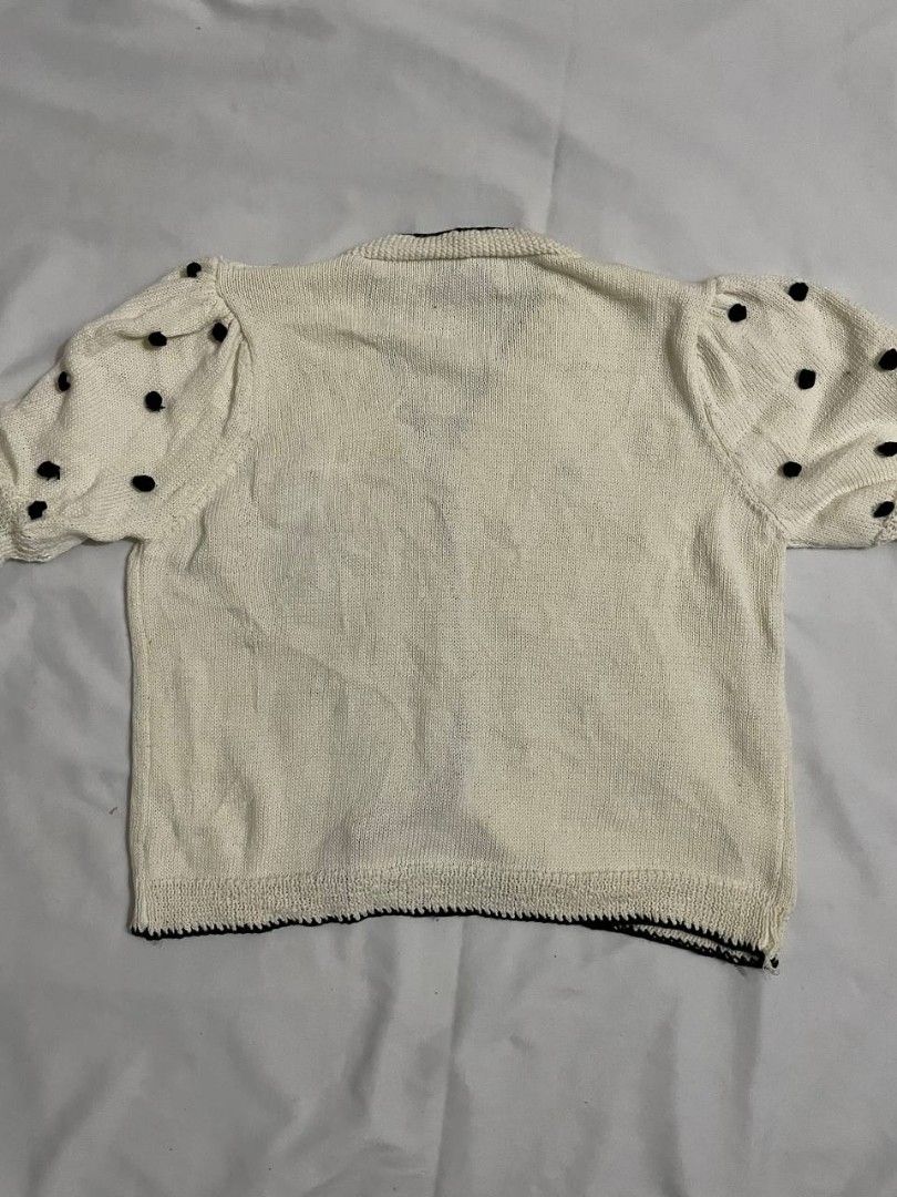 White Polka Dot Puff Sleeve Button Down Knit/Crochet Top (Category: Blouses) located in Binan City. Submitted by declutterbyjwy (Listing ID 1459394719, Image 3). Description: - can fit xs-l - quality fabric - good as new, never used - black polka dot (crochet) - perfect for layering or wearing solo minimal flaw: one missing polka dot crochet.