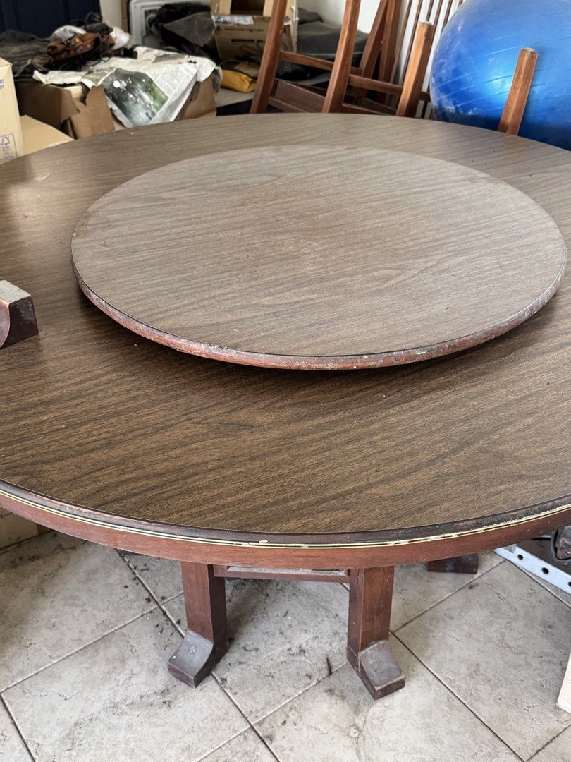Wooden Round Dining Table with Lazy Susan (Category: Tables & Sets) located in Manila. Submitted by .famousamos (Listing ID 1459342573, Image 2). Description: - antique round wooden dining table - Includes a rotating lazy susan top - Decorative lattice design on the base - Ideal for family gatherings - Note: Some wear on the edges - Selling as is - 54 inches diameter. 29.5inch height - dining chairs not included .