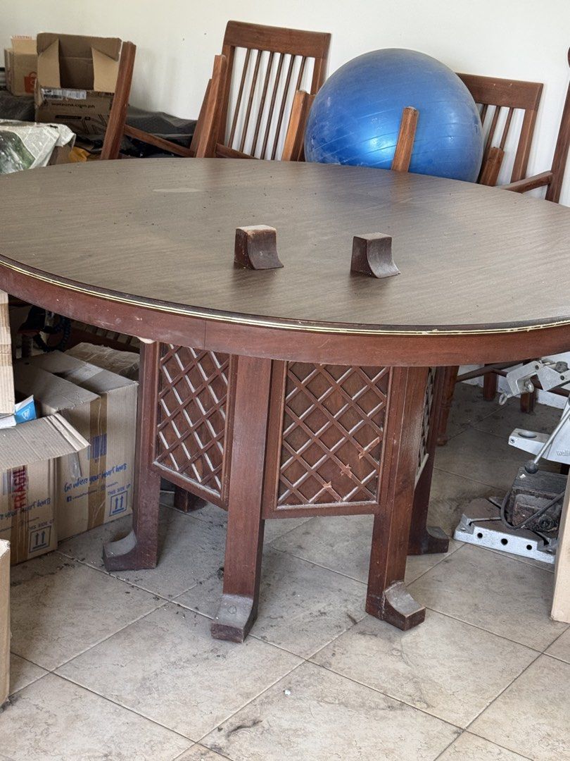 Wooden Round Dining Table with Lazy Susan (Category: Tables & Sets) located in Manila. Submitted by .famousamos (Listing ID 1459342573, Image 3). Description: - antique round wooden dining table - Includes a rotating lazy susan top - Decorative lattice design on the base - Ideal for family gatherings - Note: Some wear on the edges - Selling as is - 54 inches diameter. 29.5inch height - dining chairs not included .