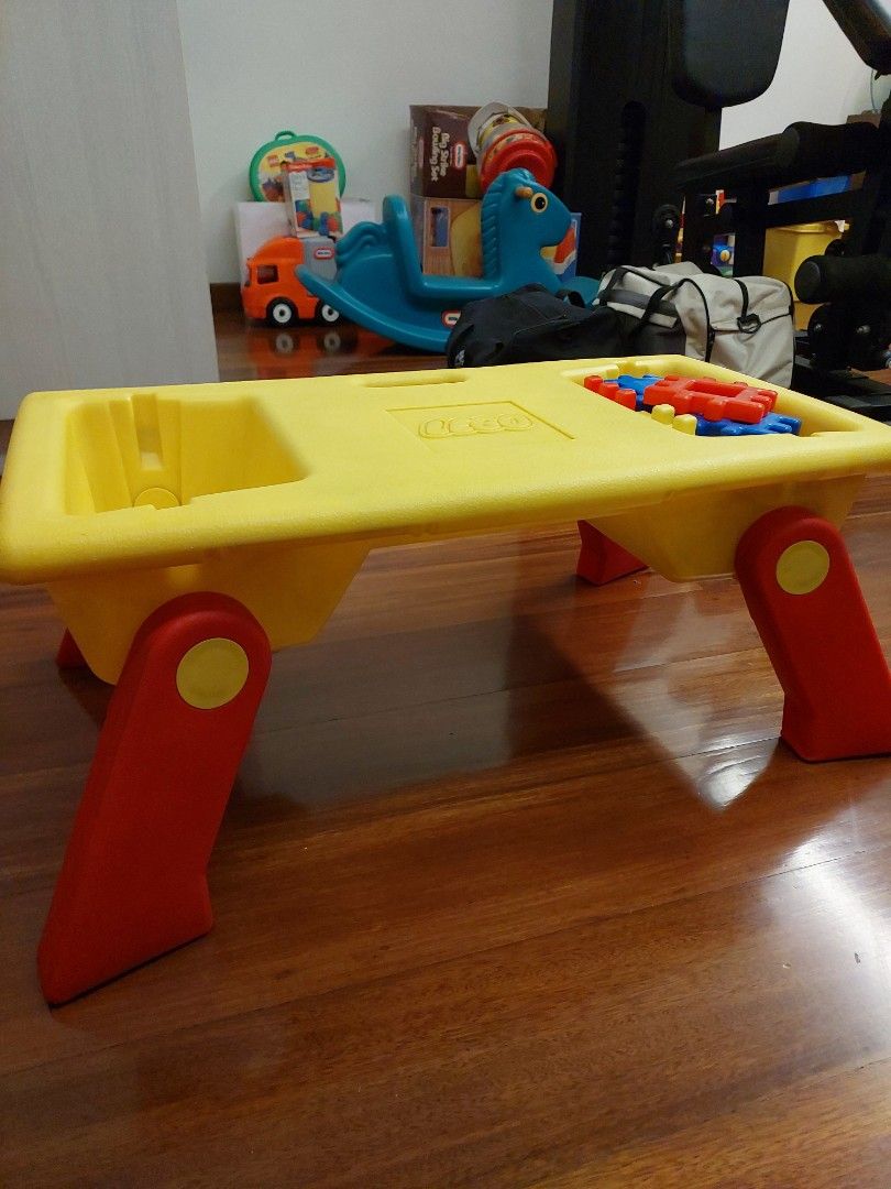 Yellow LEGO Activity Foldable Table with Red and Blue Blocks (Category: Lego & Building Sets) located in Caloocan City. Submitted by ericajane_tc (Listing ID 1459404482, Image 2). Description: - LEGO branded yellow activity table - Built-in compartments for toys and blocks - Comes with red and blue building blocks - Foldable and sturdy red legs - Ideal for fostering creative play - Easy to clean surface.