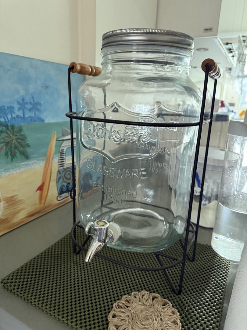 Yorkshire Glassware Beverage Dispenser with Stand (Category: Other Kitchenware & Tableware) located in Manila. Submitted by kristielyntan (Listing ID 1459318061, Image 1). Description: - Large glass beverage dispenser - Sturdy metal stand with wooden handles - Convenient spigot for easy pouring - Perfect for parties, gatherings, and events - Features Yorkshire Glassware branding (Est. 1888) - Great for serving infused water, lemonade, iced tea, a