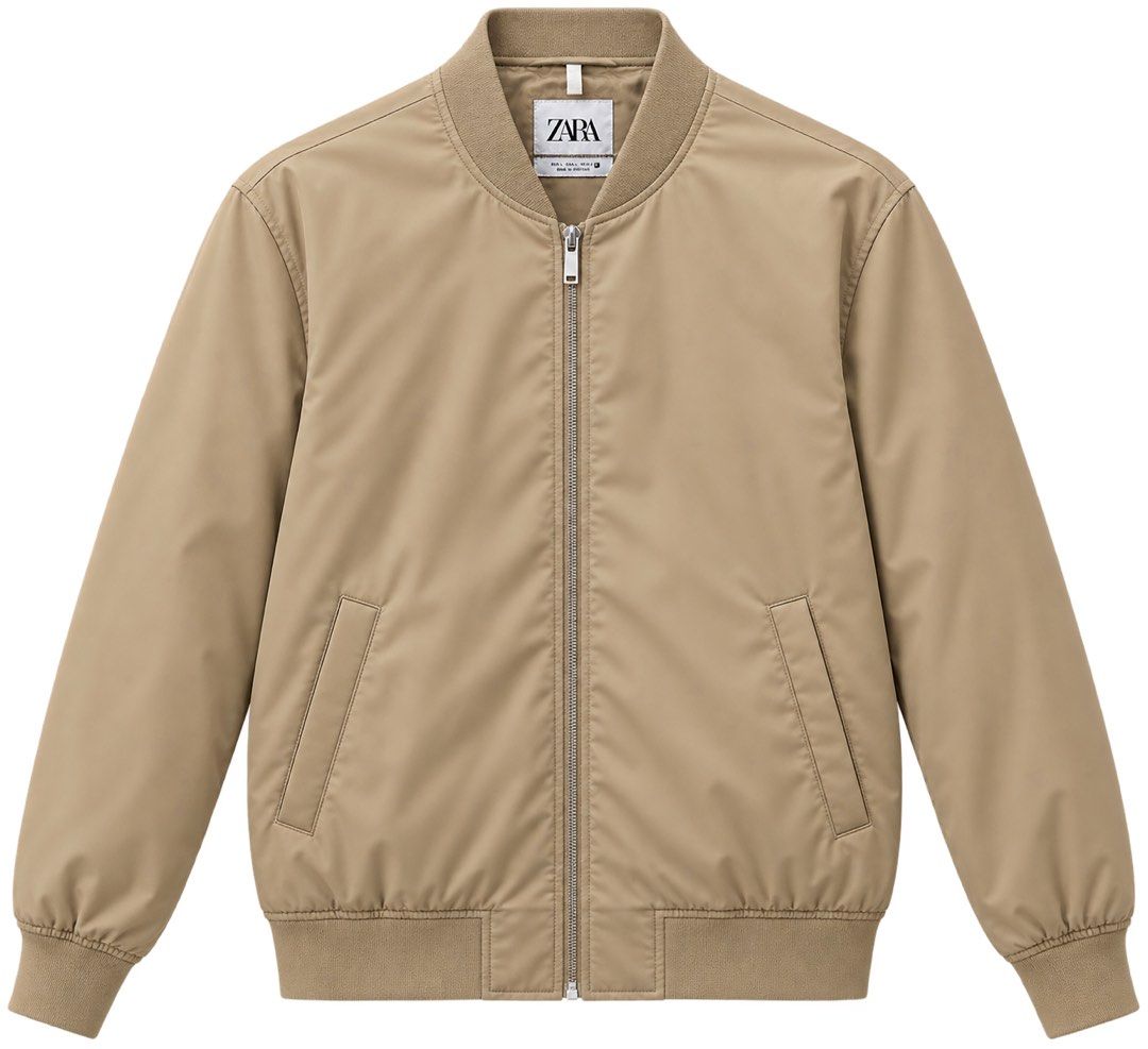Zara Beige Bomber Jacket (Category: Coats, Jackets and Outerwear) located in Cebu City. Submitted by takeitfrom.me (Listing ID 1459316587, Image 1). Description: - Classic beige bomber jacket from Zara - Zip-up front - Two side pockets - Ribbed collar, cuffs, and hem - Versatile for layering or standalone wear - Neutral color complements any wardrobe.