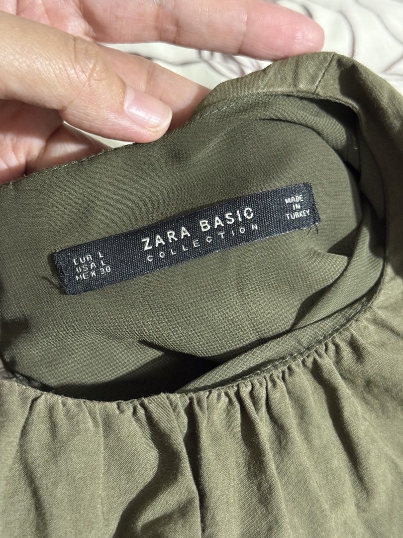 ZARA Olive Green Ruffle Dress (Category: Dresses) located in Pasay City. Submitted by janatrisha (Listing ID 1459465370, Image 2). Description: Olive green dress from ZARA - cute ruffle sleeves - Fabric has a nice, textured feel - Side slits with inner for comfortable movement - Ideal for casual occasions Size: Large First to pay basis only Gcash | BDO Delivery c/o buyer.