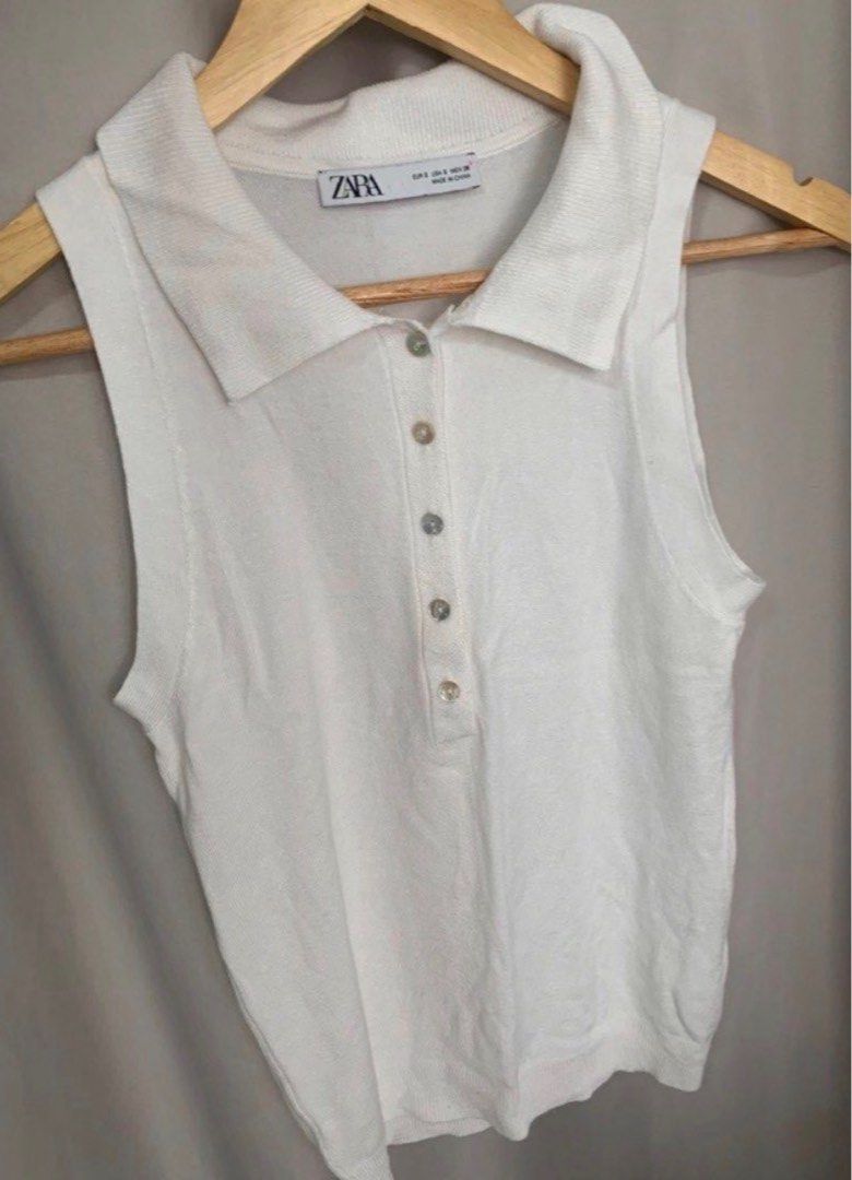 Zara White Button Up Knit Top Size S (Category: Blouses) located in Manila. Submitted by decluterthings888 (Listing ID 1459430269, Image 2). Description: - White Zara knit top - Short sleeves - Button-up front - Size S - Made in China - Simple and classic piece.