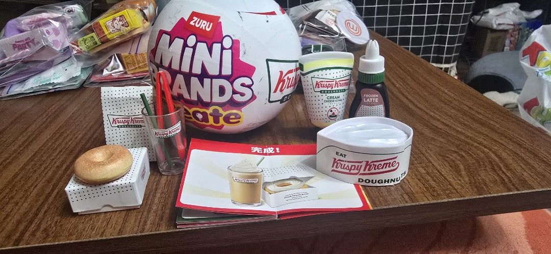 Zuru Mini Brands Krispy Kreme Playset with Accessories (Category: Kids Toys) located in Taguig. Submitted by jaymars16 (Listing ID 1459395728, Image 2). Description: - Authentic Mini Brands Krispy Kreme collection. - Includes a mini donut and a mini drink cup. - Opened to check if duplicate - Comes with additional accessories. - Features a mini Krispy Kreme hat. - Includes a small display box for showcasing. - Ideal for collectors and imaginative