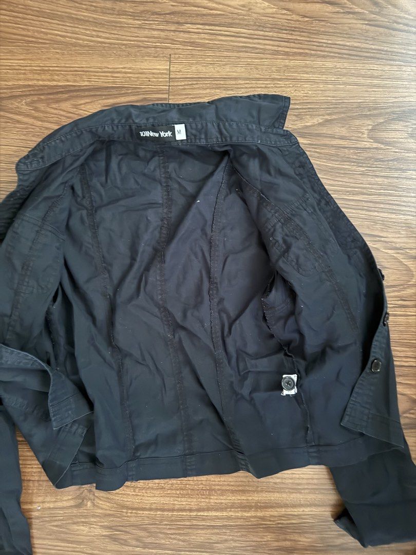 101 New York Black Utility Jacket Size M (Category: Coats, Jackets and Outerwear) located in Rizal. Submitted by thrifty.mom (Listing ID 1465081382, Image 2). Description: Black utility jacket from 101 New York. Button-up front with chest pockets and shoulder epaulets. Size M tag attached inside. Measures 18 inches across the chest and 19 inches in length. Inside care tag visible. Solid basic outerwear layer..
