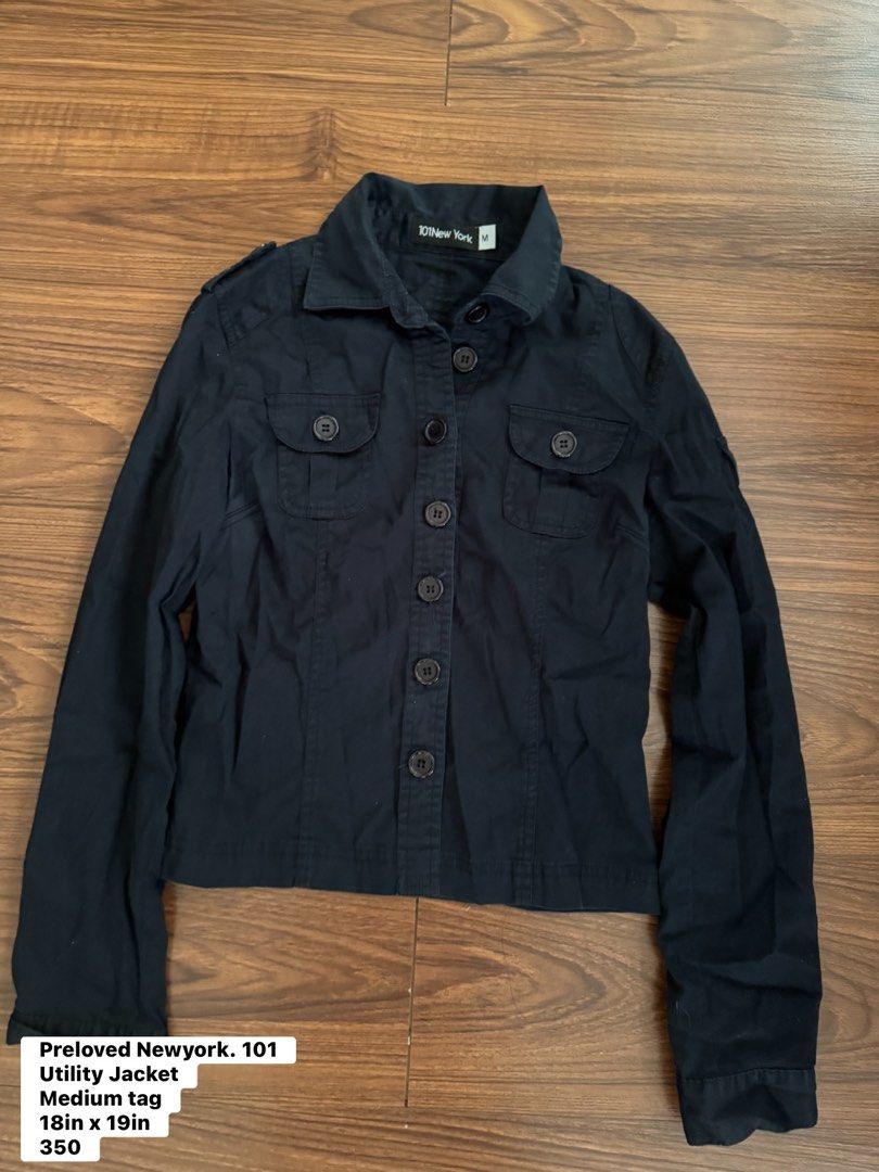 101 New York Black Utility Jacket Size M (Category: Coats, Jackets and Outerwear) located in Rizal. Submitted by thrifty.mom (Listing ID 1465081382, Image 1). Description: Black utility jacket from 101 New York. Button-up front with chest pockets and shoulder epaulets. Size M tag attached inside. Measures 18 inches across the chest and 19 inches in length. Inside care tag visible. Solid basic outerwear layer..
