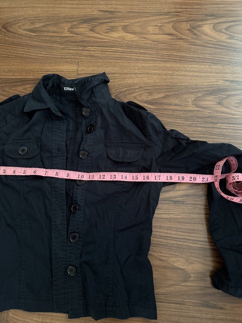 101 New York Black Utility Jacket Size M (Category: Coats, Jackets and Outerwear) located in Rizal. Submitted by thrifty.mom (Listing ID 1465081382, Image 3). Description: Black utility jacket from 101 New York. Button-up front with chest pockets and shoulder epaulets. Size M tag attached inside. Measures 18 inches across the chest and 19 inches in length. Inside care tag visible. Solid basic outerwear layer..