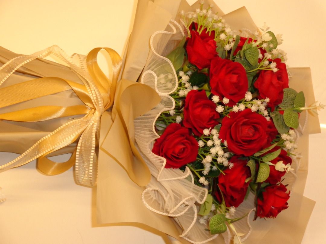 18 Red artificial rose flower bouquet with wrapping (Category: Flowers & Bouquets) located in Caloocan City. Submitted by gentletree_11a141 (Listing ID 1465065938, Image 3). Description: - Artificial red rose bouquet that will never wither - Accented with fresh-looking baby's breath and eucalyptus leaves - Wrapped in stylish beige paper with a white mesh ruffle trim - Finished with a shiny gold ribbon tie - Ideal gift for birthdays, anniversaries