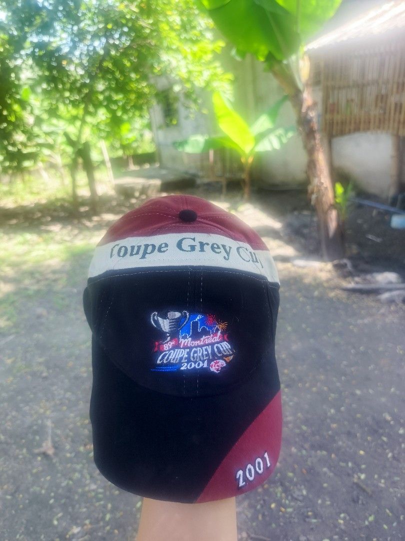 2001 Montreal Coupe Grey Cup Baseball Cap Hat (Category: Caps & Hats) located in Caloocan City. Submitted by dancabanayan09 (Listing ID 1465002443, Image 2). Description: - Item: Montreal Coupe Grey Cup 2001 Baseball Hat - Colorway: Black, maroon, and white colorblock design - Details: Embroidered graphics on front, text along the white band, and 2001 stitched on the brim corner - Fit: One size fits most with an adjustable strap in the back - Con