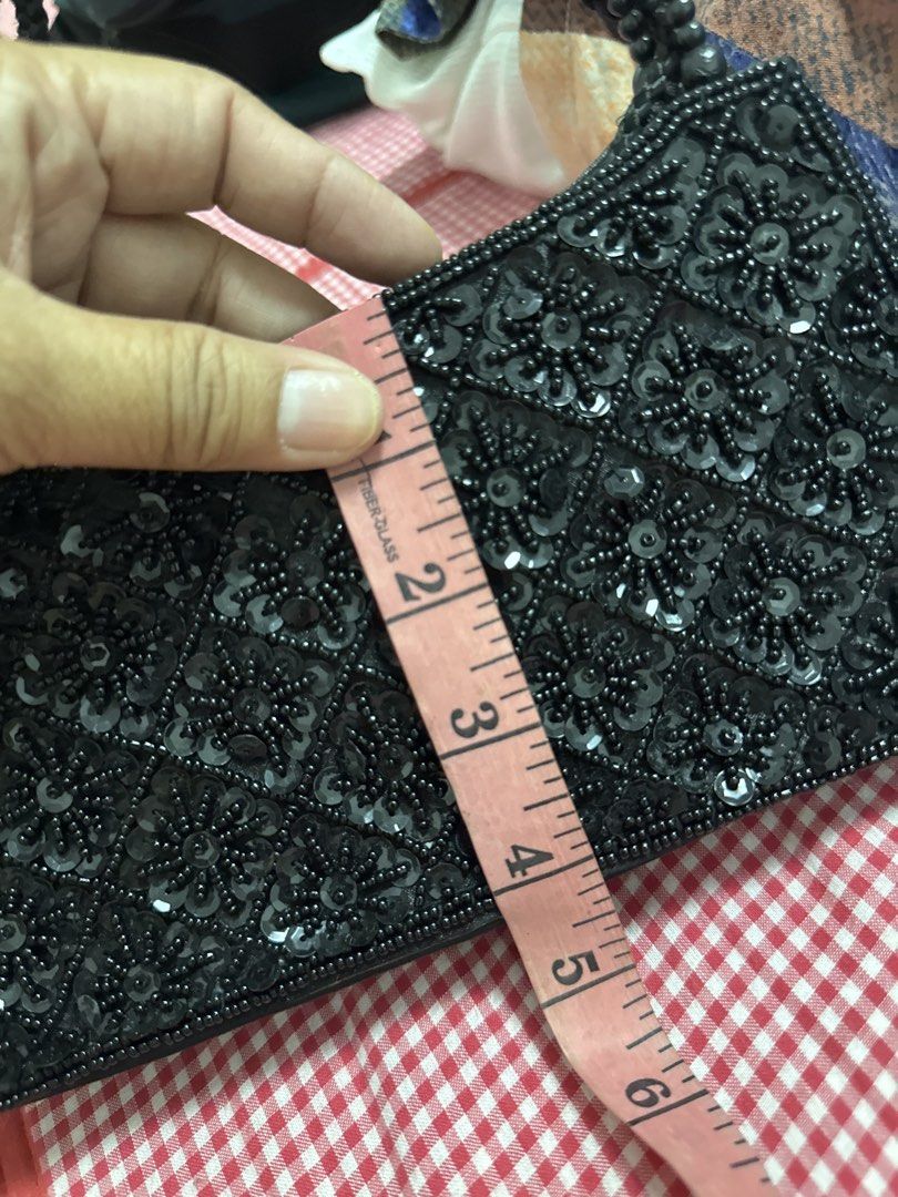 2027 Black Beaded Sequin Evening Bag Shoulder Bag (Category: Shoulder Bags) located in Silang. Submitted by sari2bilina (Listing ID 1465126459, Image 3). Description: - Color: Classic black - Design: Full front sequin and beadwork with smooth black back and bottom - Dimensions: Approx. 11 inches long x 5 inches tall - Features: Elegant beaded handle and secure zipper top closure - Perfect for: Nights out, parties, and special occasions - Conditio