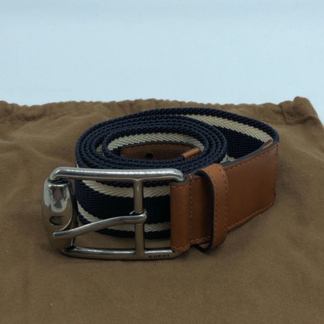 267009686 GUCCI BELT 281802 OLD TYPE CANVAS (Category: Belts) located in Taguig. Submitted by ecoring.ph (Listing ID 1464997458, Image 2). Description: ◆CONDITION: B ◆DESCRIPTIONS: (Other defects/info:) The strap of the belt is stained and dirty, and shows signs of use. The leather of the belt is scratched, scuffed, and wrinkled, has press marks, and shows signs of use. The buckle of the belt is scratched and has minimal dents, and shows signs of