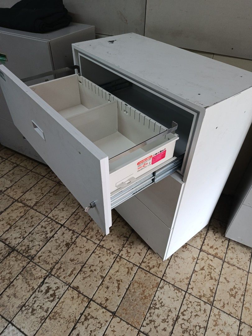 3-Drawer Metal Filing Cabinet Office Storage (Category: Office Furniture & Fixtures) located in Quezon City. Submitted by kevinmacabata12997160 (Listing ID 1464972736, Image 3). Description: - Type: Sturdy metal filing cabinet - Color: Off-white - Dimensions: 90cm (W) x 45cm (D) x 110cm (H) - Storage: 3 spacious drawers with built-in lock and keys - Features: Adjustable dividers in the top drawer for hanging folders - Condition: General wear and 