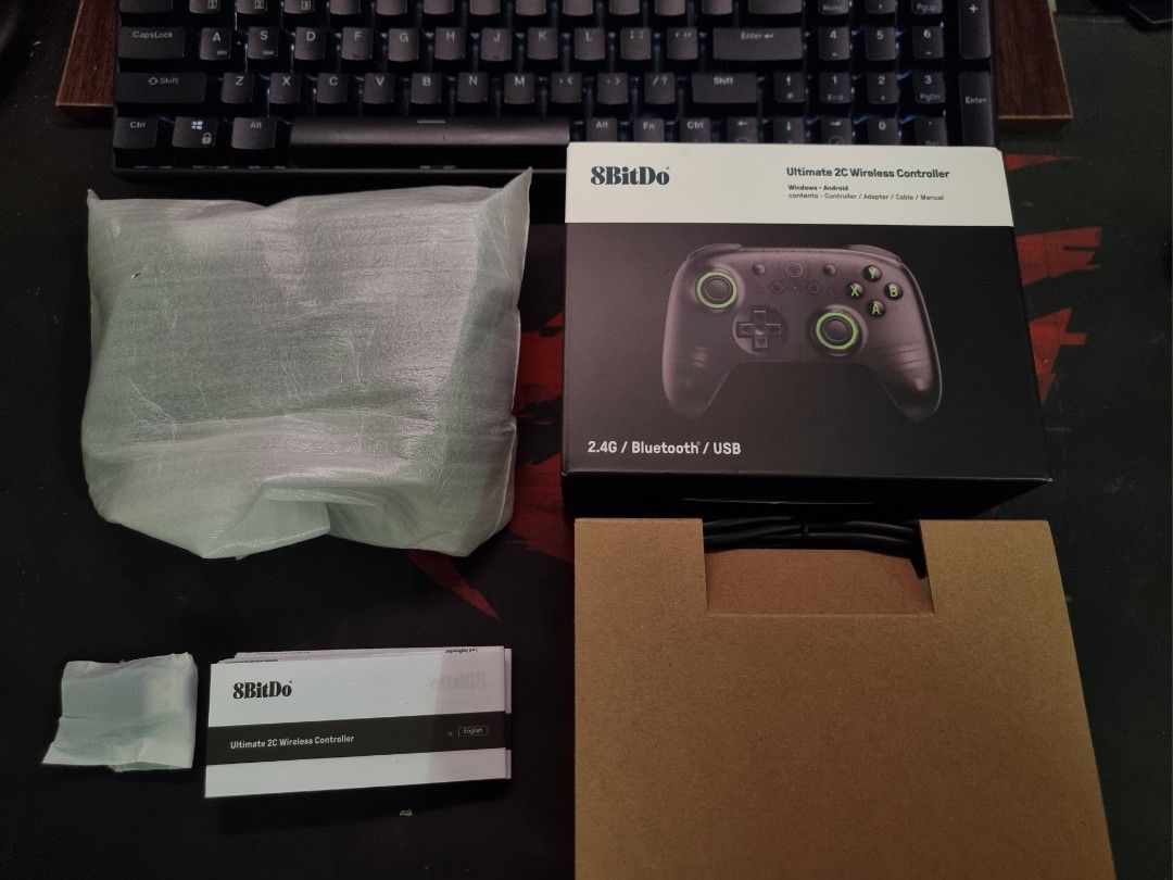 8BitDo Ultimate 2C Wireless Controller (Category: Controllers) located in Kuala Lumpur. Submitted by mizuhashien (Listing ID 1465146232, Image 2). Description: 8BitDo Ultimate 2C Wireless Controller (Black transparent, green) Condition: Brand new, plastic still unpeeled. Purchased on 9/9/26, current RRP at RM87.48. Selling because was not what I expected. I previously owned a Fantech WGP15 EOS Pro (worth RM150), so this felt like a downgrade, so 