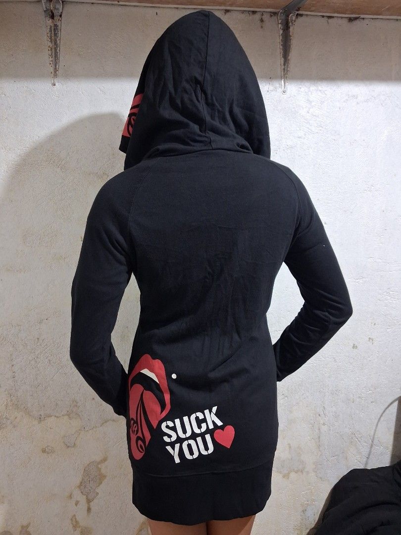Acid Black Cherry Zip-Up Hoodie (Category: Coats, Jackets and Outerwear) located in Manila. Submitted by rossthrift (Listing ID 1465130785, Image 3). Description: Black zip-up hoodie from Acid Black Cherry. Big red and white graphic prints on the back and hood. Text reads 'SUCK YOU' near the lower back hem. Small brand logo printed on the chest. Long sleeves with thumb holes. Full zipper closure down the front..