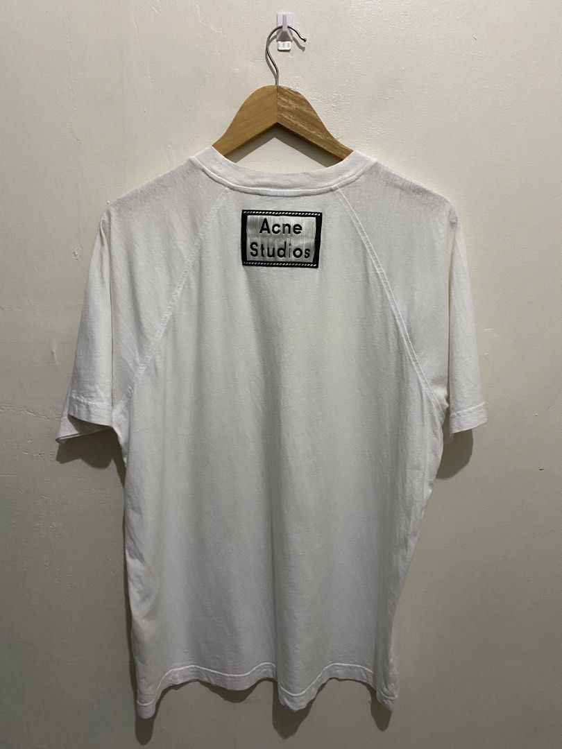 Acne Studios White Pocket T-Shirt Size M (Category: Shirts) located in Cainta. Submitted by mars_olavere (Listing ID 1465099189, Image 2). Description: - Brand: Acne Studios - Color: White - Size: M (180/96A) - Material: 100% Cotton, Made in Portugal - Fit: Classic everyday fit - Details: Raglan sleeves, front chest pocket, signature branding patch on back collar - Condition: Excellent, must-have Stockholm staple.