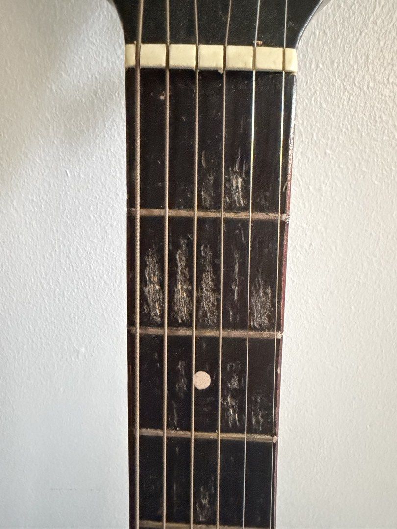 Acoustic Guitar Mandaue (Category: Musical Instruments) located in Balanga. Submitted by kylace (Listing ID 1464994824, Image 2). Description: - Guitar neck with heavy fingerboard wear - Deep groove marks between frets from intense fingernail contact - Nut and frets are still intact - Features dot inlay at the 5th fret - Strings currently attached - Shipping fee shouldered by the buyer.