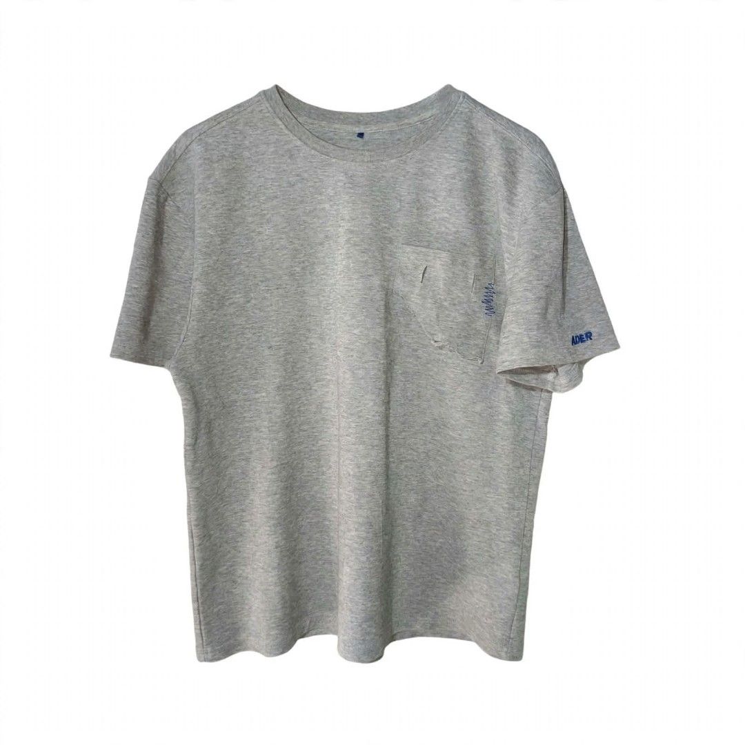 ADER Error | Men's Grey T-Shirt Pocket Tee (Category: Tshirts & Polo Shirts ) located in Naga. Submitted by bossyingthrifts (Listing ID 1462772588, Image 1). Description: ADER Error | Men's Grey T-Shirt Pocket Tee - ADER Error Grey T-Shirt - Features a chest pocket with distressed detailing - Small ADER logo embroidered on the sleeve - Distinctive small blue tag near the collar - Ideal for casual and everyday styling Size: A1 on tag (can fit Larg