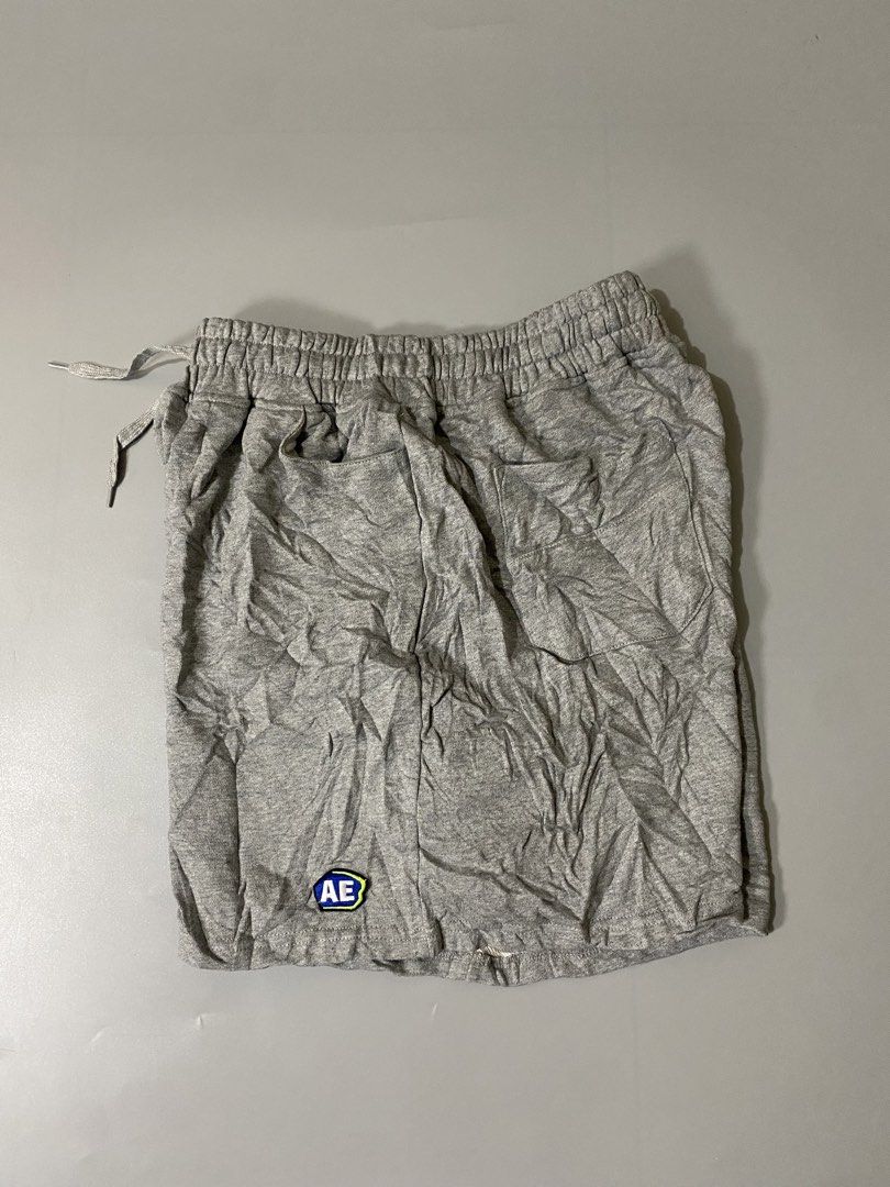 ADER Error Grey Sweatshorts with Tags (Category: Shorts) located in Davao. Submitted by brandedthrift.134 (Listing ID 1465086011, Image 1). Description: - Brand new with original store tags - Authentic ADER Error grey sweatshorts - Elastic waistband with adjustable drawstring - Embroidered AE logo patch near the hem - Convenient back patch pockets with signature blue branding tab - Soft and comfortable cotton blend material, ideal for casual wear