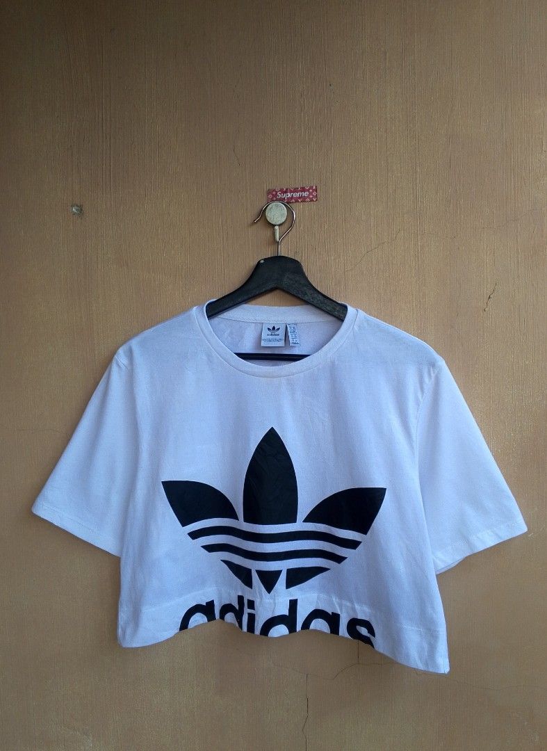 Adidas Big Logo Cut Out Cropped Tee (Category: Shirts) located in Lipa City. Submitted by MEECHYTWO2TWO (Listing ID 1465005790, Image 3). Description: • ADIDAS BIG LOGO CUT OUT TEE - Size: UK:6 / US: XS / JP: M - Best fit S-M - Width: 19 / Length: 16.5 - No issue - Location: Lipa City, Batangas - Excellent condition - Color rate: 10/10 - Additional sf +75 - Mop: GCASH/NO COD - Payment first tomorrow will be shipped.