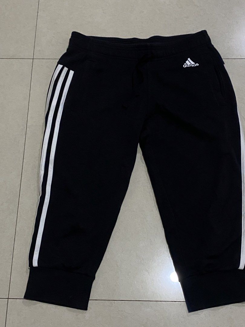 Adidas Black 3-Stripe Capri Joggers Size M (Category: Joggers) located in Taguig. Submitted by _lly.wyn (Listing ID 1464989912, Image 1). Description: - Brand: Adidas - Style: Black capri joggers with white 3-stripes - Size: Medium - Origin: Made in Cambodia - Material: Comfortable cotton blend - Features: Elastic waistband with adjustable drawstring, ribbed hem cuffs - Condition: 100% Authentic, great for workouts or casual wear.
