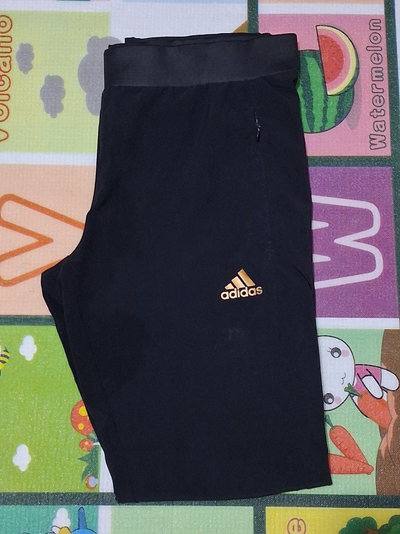 Adidas Black Athletic Pants (Category: Joggers) located in Manila. Submitted by rossthrift (Listing ID 1465132709, Image 1). Description: - Brand: Adidas - Color: Black with Gold printed logo - Waistband: Comfortable elastic - Pockets: Secure zippered side pockets - Ideal for: Workouts and daily casual wear.