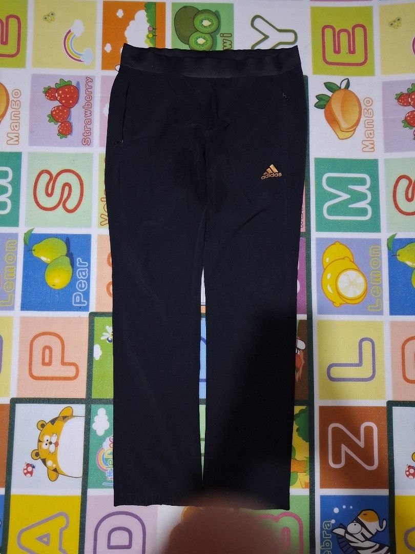 Adidas Black Athletic Pants (Category: Joggers) located in Manila. Submitted by rossthrift (Listing ID 1465132709, Image 2). Description: - Brand: Adidas - Color: Black with Gold printed logo - Waistband: Comfortable elastic - Pockets: Secure zippered side pockets - Ideal for: Workouts and daily casual wear.