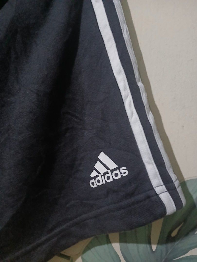 Adidas Black Shorts with White Stripes (Category: Shorts) located in Caloocan City. Submitted by vincefresn21903 (Listing ID 1464993448, Image 2). Description: - Brand: Adidas - Color: Black with classic white side stripes and printed logo - Size: A/S (175/76A) - Waistband: Elastic for a comfortable fit - Condition/Use: Great for workouts, gym sessions, or casual lounging at home - Fast shipping available, PM to order!.