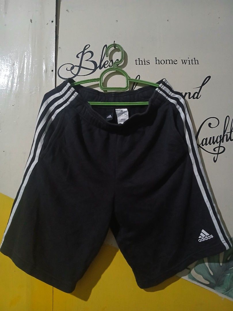 Adidas Black Shorts with White Stripes (Category: Shorts) located in Caloocan City. Submitted by vincefresn21903 (Listing ID 1464993448, Image 1). Description: - Brand: Adidas - Color: Black with classic white side stripes and printed logo - Size: A/S (175/76A) - Waistband: Elastic for a comfortable fit - Condition/Use: Great for workouts, gym sessions, or casual lounging at home - Fast shipping available, PM to order!.