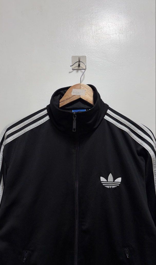 Adidas Firebird Black Track Jacket (Category: Coats, Jackets and Outerwear) located in Manila. Submitted by petlover777 (Listing ID 1464585196, Image 2). Description: Size medium to large (21.5 x 27) GOOD AS NEW! NO ISSUE 📍Pick up location: Barangay 235 Hall Abad Santos Manila 🛵Delivery: J&t | Lalamove.