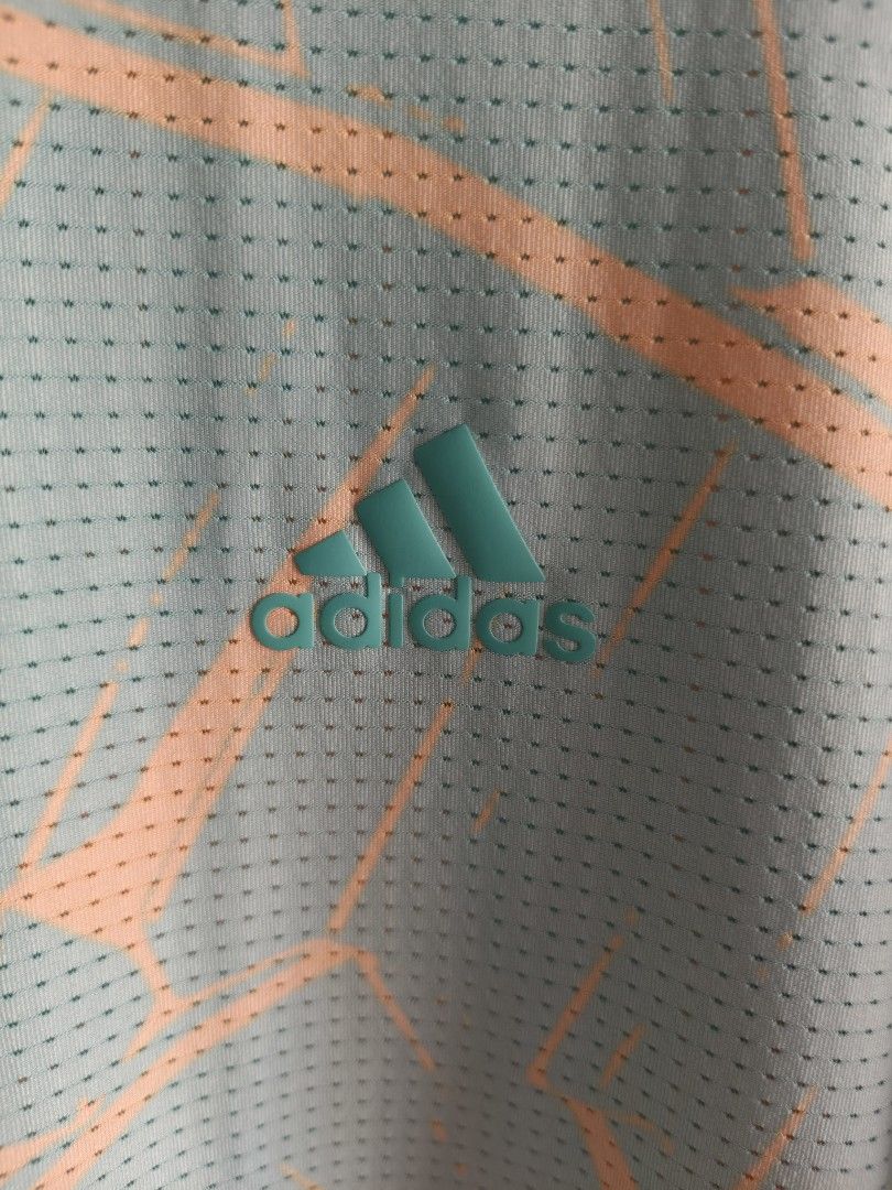 Adidas Golf Polo Shirt (Category: Tshirts & Polo Shirts ) located in Siniloan. Submitted by wingedwardrobe (Listing ID 1460469215, Image 2). Description: W24 L40 Size L An Adidas short-sleeve polo shirt dress in a mint green and peach abstract leaf print with perforated mesh fabric and side slits. 📢 𝑺𝑯𝑶𝑷 𝑹𝑬𝑴𝑰𝑵𝑫𝑬𝑹𝑺 📢 - 𝑺𝒊𝒛𝒆𝒔 𝒂𝒓𝒆 𝒂𝒑𝒑𝒓𝒐𝒙𝒊𝒎𝒂𝒕𝒆. 𝑷𝒍𝒆𝒂𝒔𝒆 𝒎𝒂𝒏𝒂𝒈𝒆 𝒚𝒐𝒖𝒓 𝒆𝒙𝒑𝒆𝒄𝒕𝒂𝒕𝒊𝒐𝒏𝒔. - 𝑪𝒐𝒍𝒐𝒓