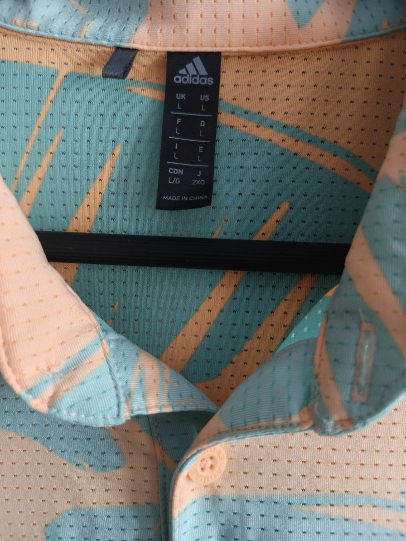 Adidas Golf Polo Shirt (Category: Tshirts & Polo Shirts ) located in Siniloan. Submitted by wingedwardrobe (Listing ID 1460469215, Image 3). Description: W24 L40 Size L An Adidas short-sleeve polo shirt dress in a mint green and peach abstract leaf print with perforated mesh fabric and side slits. 📢 𝑺𝑯𝑶𝑷 𝑹𝑬𝑴𝑰𝑵𝑫𝑬𝑹𝑺 📢 - 𝑺𝒊𝒛𝒆𝒔 𝒂𝒓𝒆 𝒂𝒑𝒑𝒓𝒐𝒙𝒊𝒎𝒂𝒕𝒆. 𝑷𝒍𝒆𝒂𝒔𝒆 𝒎𝒂𝒏𝒂𝒈𝒆 𝒚𝒐𝒖𝒓 𝒆𝒙𝒑𝒆𝒄𝒕𝒂𝒕𝒊𝒐𝒏𝒔. - 𝑪𝒐𝒍𝒐𝒓