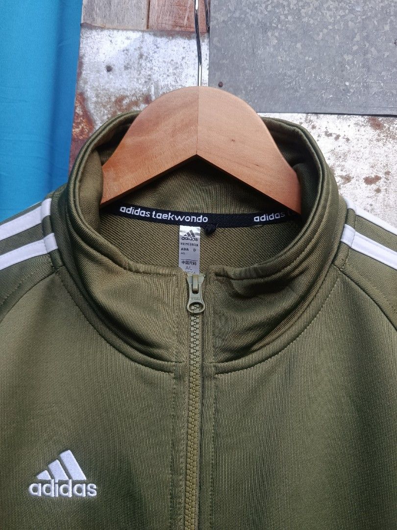 ADIDAS JACKET (Category: Activewear) located in Iloilo. Submitted by _lemornosnas02 (Listing ID 1465060381, Image 3). Description: olive green Adidas track jacket -size large on size -dimes 22x28 -need wash lang -no issue as new -location iloilo -plus ship via lbc.