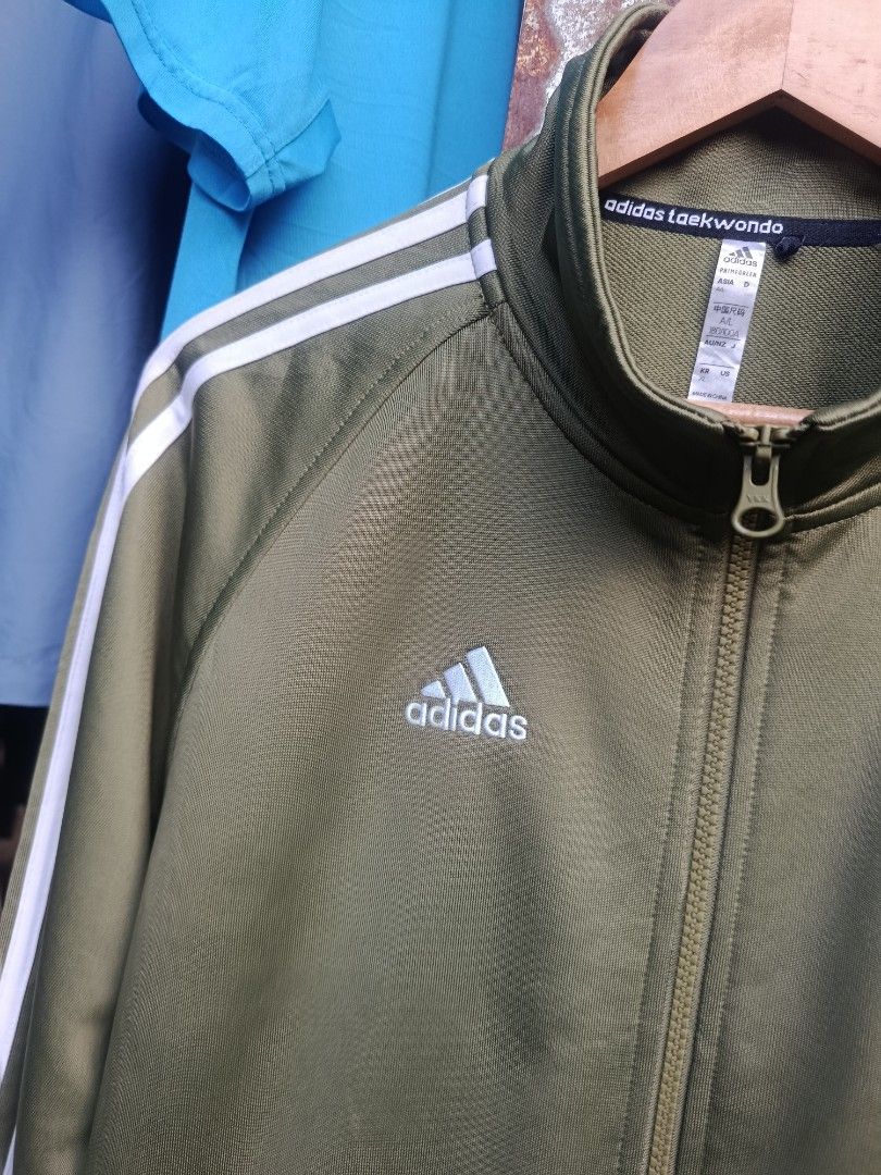 ADIDAS JACKET (Category: Activewear) located in Iloilo. Submitted by _lemornosnas02 (Listing ID 1465060381, Image 2). Description: olive green Adidas track jacket -size large on size -dimes 22x28 -need wash lang -no issue as new -location iloilo -plus ship via lbc.